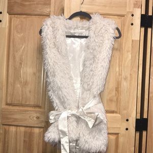 Off-white faux fur vest with tie ribbon.